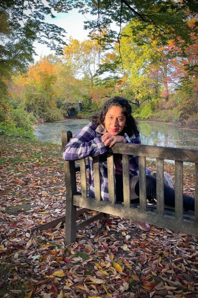 Vanessa sitting in a chair on a park